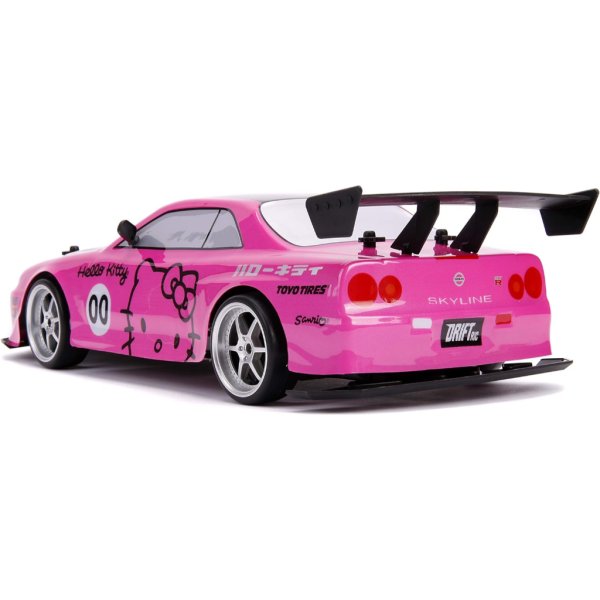 jada toys hello kitty nissan skyline gt r (bnr34) drift power slide elite r:c, usb charging, with 4 extra tires, pink2