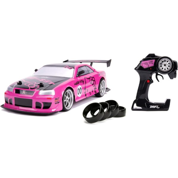 jada toys hello kitty nissan skyline gt r (bnr34) drift power slide elite r:c, usb charging, with 4 extra tires, pink3